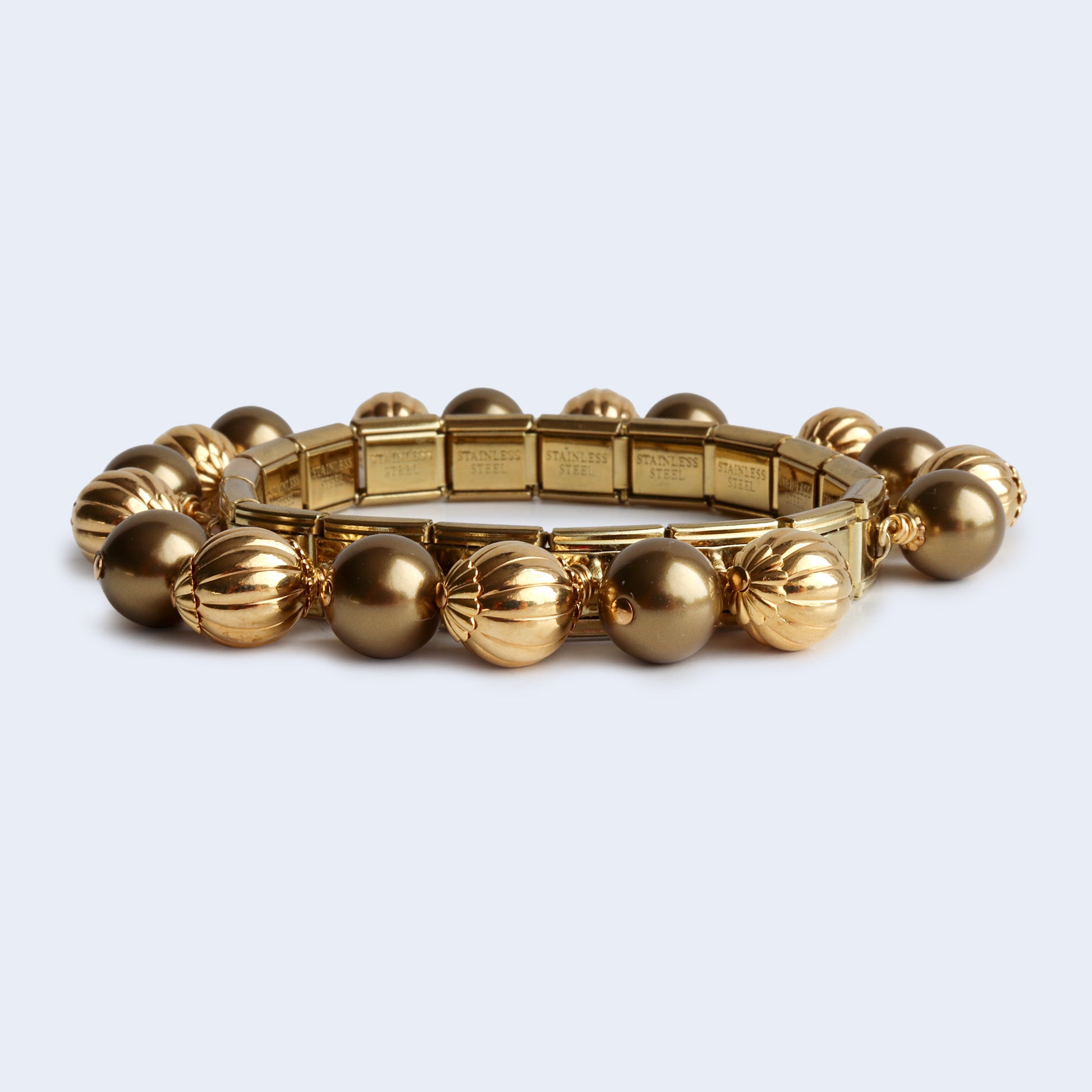 Gold tone beaded Swarovski pearl and metal beads bangle bracelet.