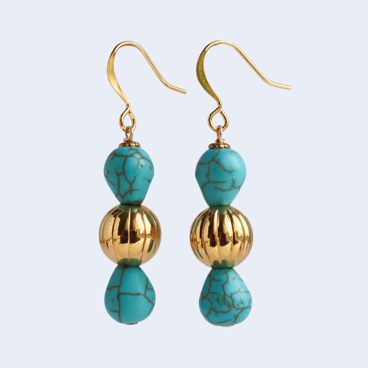 Gemstone drop earrings in gold tone.