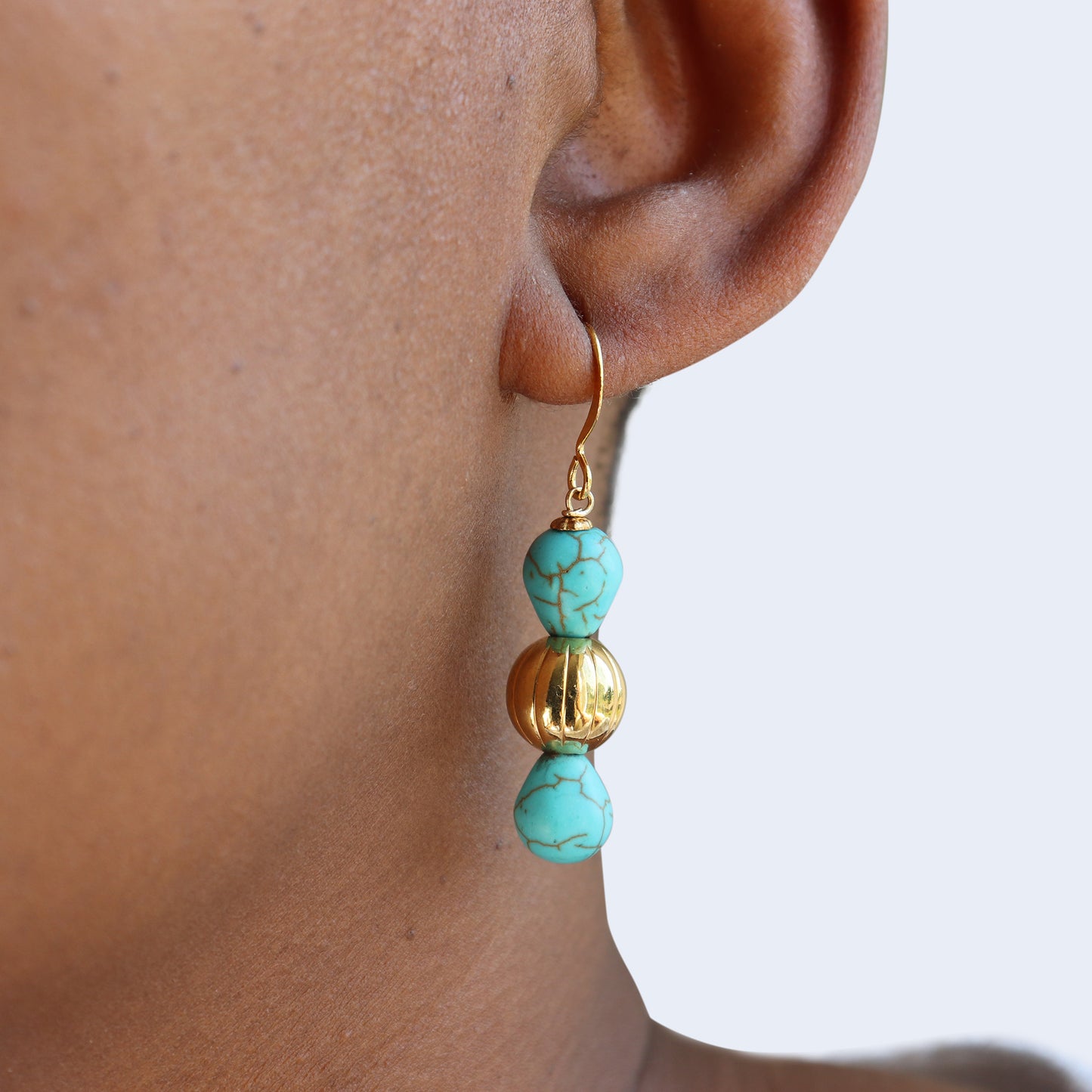 Blue magnesite earrings in gold plated brass.