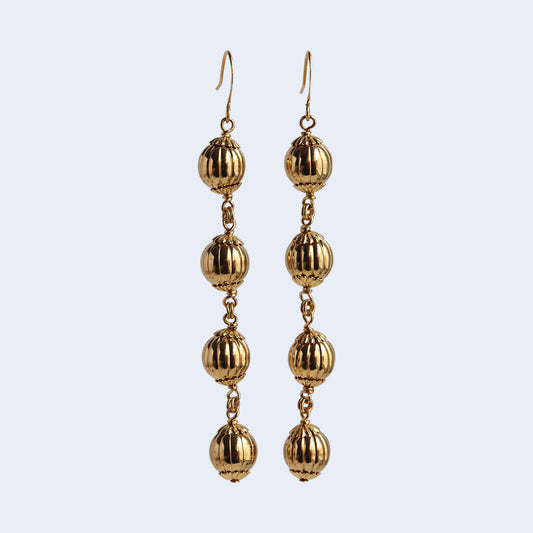 Gold-plated brass dangle earrings.